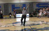 Burbank Coach Jerry DeLaurie raises his arms in triumph after the buzzer-beating victory (Photo by Ross A. Benson)