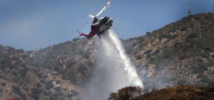 Los Angeles City Copter 5 makes a drop on a small brush fire that occurred Monday afternoon near DeBell golf course. (Photo by Ross A. Benson)