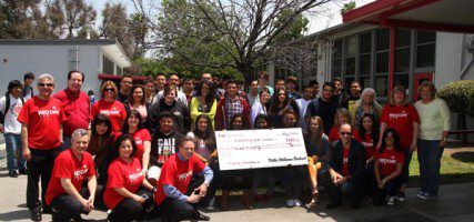Students and Keller Williams Staff accept check for needed calculators. (Photo by Ross A. Benson)