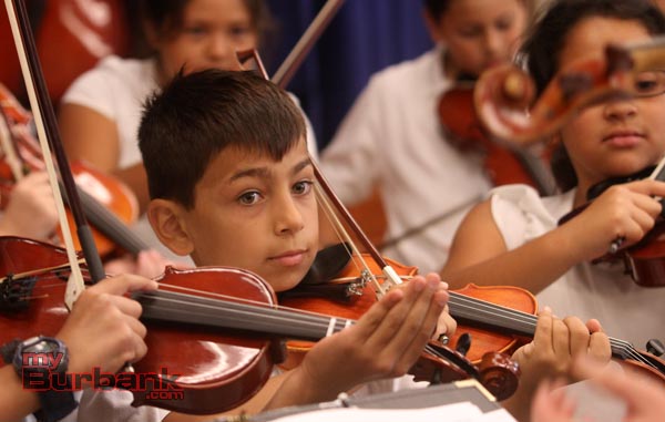 Young Musicians Play Movie Favorites At Providencia Elementary School