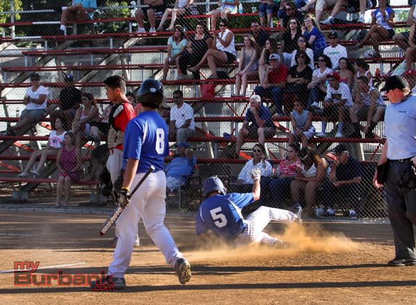 Connor Lockheimer slides across home plate for the Bulldogs (Photo by Ross A. Benson)