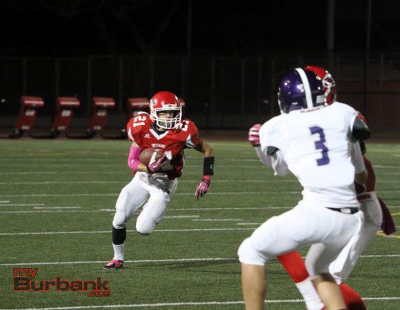 Aidan Anding carries the ball for the Indians (Photo by Ross A. Benson)