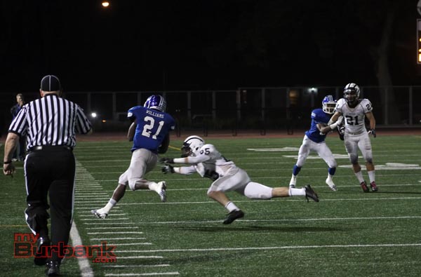 James Williams finds running room along the sideline (Photo by Ross A. Benson)