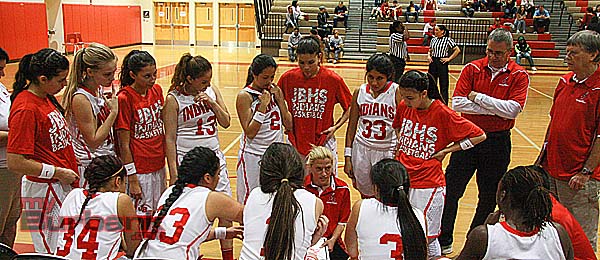 Coach Vicky Oganyan shares wisdom during a timeout (Photo by Dick Dornan)