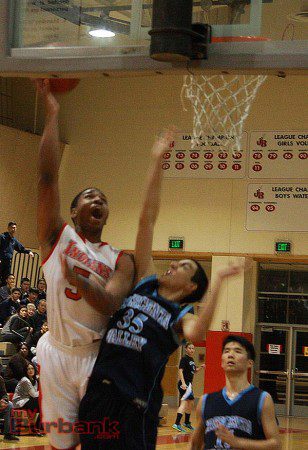 Amaad Wainright soars in for the layup (Photo by Dick Dornan)
