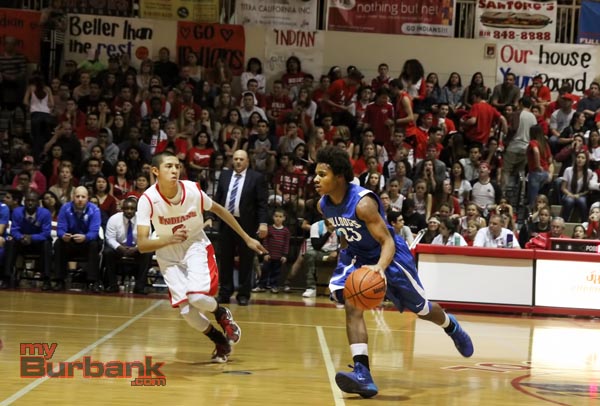 Cody Boseman drives up court for the Bulldogs (Photo by Ross A. Benson)