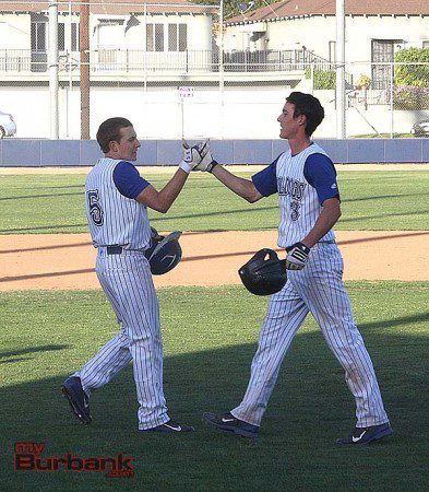 Cameron Briggs (rt) is congratulated by Conner Lockheimer after Briggs' game winning hit (Photo by Dick Dornan)