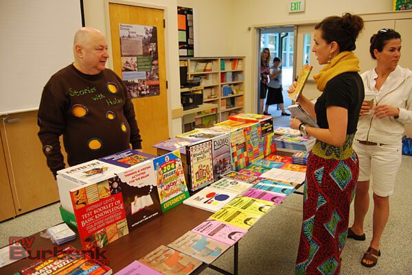 Nathan Levy talks with a conference attendee.  (Photo By Lisa Paredes)