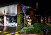 House Fire Destroys Large Hillside Home Lighting up Nightime Sky.