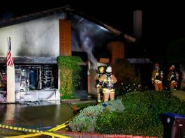 House Fire Destroys Large Hillside Home Lighting up Nightime Sky.