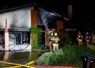 House Fire Destroys Large Hillside Home Lighting up Nightime Sky.