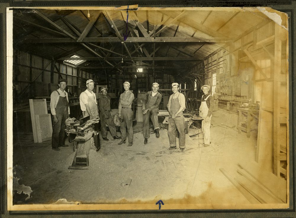 Photo of crew at Burbank Planing Mill, located at the corner of Olive Ave. and Front St. Notes on the photo identify some of the men: Claude Newman [far left], Lawrence McDowell [center], and Wil Bean [third from right]. Photo and caption info courtesy of Burbank Public Library, Burbank in Focus Office.